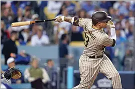  ?? ASHLEY LANDIS / AP, FILE ?? San Diego Padres’ Manny Machado follows through on an RBI-double during the third inning in Game 2 of a baseball NL Division Series against the Los Angeles Dodgers on Oct. 12, 2022 in Los Angeles.