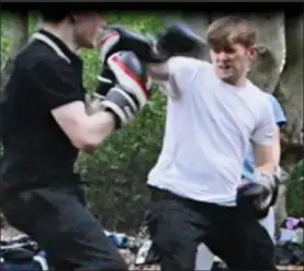  ??  ?? Training: Hannam takes part in a boxing session with the group