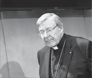  ?? Alberto Pizzoli AFP/Getty Images ?? “I AM looking forward finally to having my day in court,” Cardinal George Pell said at the Vatican. “I repeat that I am innocent of these charges. They are false.… The whole idea of sexual abuse is abhorrent to me.”