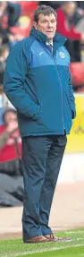  ??  ?? Tommy Wright looks on as his St Johnstone side lose out 2-1 to visitors Aberdeen.