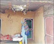  ?? ANI ?? A woman showing the damage to her house after ceasefire violation by Pakistan along the LoC in Poonch on Sunday.