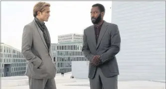  ??  ?? Robert Pattinson, left, and John David Washington in a scene from “Tenet.”