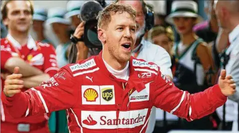  ??  ?? Seid umschlunge­n: Sebastian Vettel fuhr nach  Rennen ohne Sieg wieder einmal als Erster ins Ziel. Foto: Mark Horsburgh, Reuters