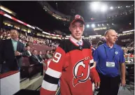  ?? Bruce Bennett / Getty Images ?? Tyce Thompson reacts after being selected 96th overall by the New Jersey Devils during the 2019 NHL Draft at Rogers Arena in Vancouver in 2019.