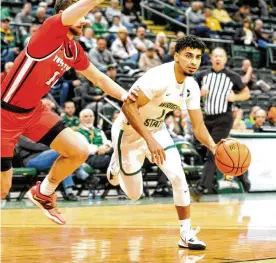  ?? DAVID A. MOODIE / CONTRIBUTE­D ?? Wright State guard Trey Calvin was a first-team All-Horizon League pick this season after averaging 20.3 points per game. That figure ranked second in the league and 22nd nationally.
