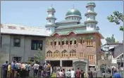  ?? PIC/PTI ?? People gather outside the mosque where two militants were hiding during an encounter with army soldiers, at Pampore in Pulwama District of South Kashmir