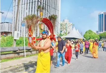  ?? — Photo by Roystein Emmor ?? Devotees walk take part in the Thaipusam procession at Jalan Rock.