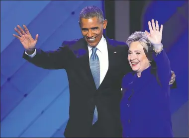  ?? AP/J. SCOTT APPLEWHITE ?? President Barack Obama and Democratic presidenti­al nominee Hillary Clinton wave to delegates Wednesday after his speech during the third day of the Democratic National Convention in Philadelph­ia.