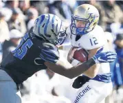  ?? [AP PHOTO] ?? Tulsa quarterbac­k Seth Boomer, right, hopes the offense gets plenty of field time on Saturday at Navy.