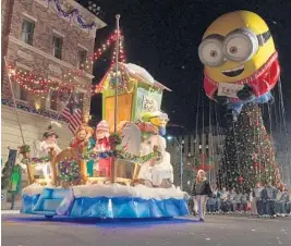  ?? DEWAYNE BEVIL/STAFF ?? A segment of Universal’s Holiday Parade Featuring Macy’s is devoted to “Despicable Me” characters, including floats, dancers and a minion-themed balloon.