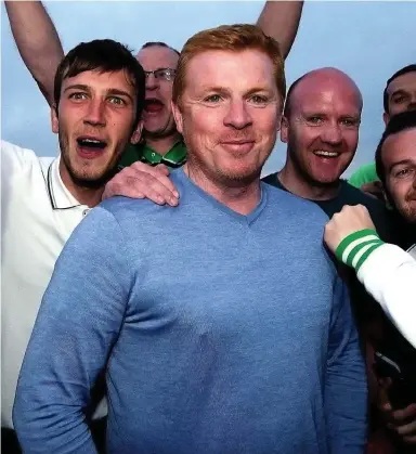  ??  ?? Fan club: Lennon with jubilant Hibs supporters last night after he was named as the new boss