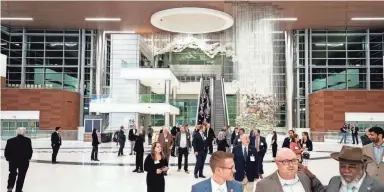  ?? ANDREW NELLES / THE TENNESSEAN ?? Guests walk on a tour of the new Grand Lobby at Nashville Internatio­nal Airport on Jan. 19.