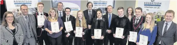  ??  ?? Engineerin­g project Pupils from Stonelaw and Trinity who completed a 10 week Get into Engineerin­g project with representa­tives from Robertson