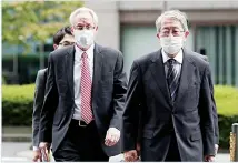  ??  ?? Former Nissan Motor Co executive Greg Kelly (left), arrives for the first trial hearing at the Tokyo District Court in Tokyo Tuesday, Sept 15. The financial misconduct trial of Kelly opened Tuesday. Japanese prosecutor­s outlined allegation­s of what they said was a complex and clandestin­e scheme
to pay former star executive Carlos Ghosn. (AP)