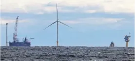  ?? JULIA NIKHINSON/AP ?? The first operating South Fork Wind farm turbine, is seen on Dec. 7, 2023, 35 miles east of Montauk Point, N.Y. The federal government said Friday it’s moving forward with developing a large area of ocean off New England for offshore wind.