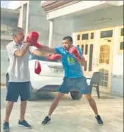  ?? HT PHOTO ?? ■
Vikas Krishan (R) trains with his father.