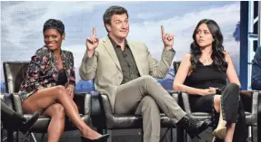  ?? CHRIS PIZZELLO/INVISION/AP ?? Nathan Fillion, with Afton Williamson, left, and Alyssa Diaz, stars as a 40-year-old newbie on the LAPD in “The Rookie.”