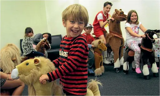  ?? YVETTE BATTEN/ FAIRFAX NZ ?? Bode Poulton enjoys his ride on the new Ponycycles at Rumpus Room.