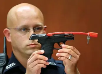  ?? JOE BURBANK/THE ASSOCIATED PRESS FILE PHOTO ?? The gun used to kill the Florida teen is presented in court during George Zimmerman’s murder trial in 2013.