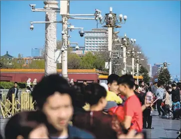  ?? AFP/Getty Images ?? THE U.S. HAS barred federal agencies from using Chinese-made surveillan­ce cameras, like these in Beijing.