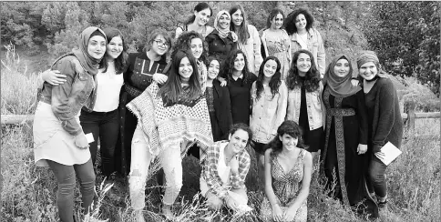  ?? — AFP photo ?? Palestinia­n and Israeli Jewish girls take a group photo together at the ‘Creativity for Peace’ camp, which every year brings up to 20 girls, half Jewish Israelis and half Palestinia­ns from Israel, the West Bank and Gaza to Santa Fe, New Mexico.