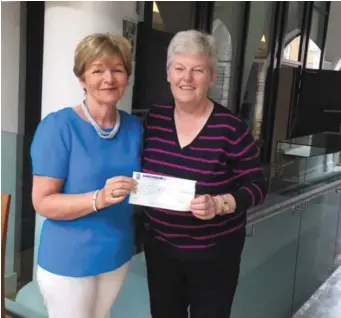  ??  ?? Ann Shortt of the Drogheda Alzheimer branch receiving a cheque from Olive Murdock from Baltray who raised €1,150 by holding a tea day for all her family and friends in aid of its building fund . Ms Shortt said : ‘’This was an amazing amount for Olive...