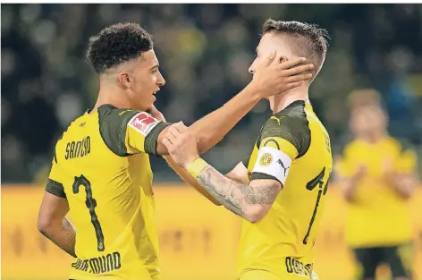  ?? FOTO: DPA ?? Zwei Männer der Hinrunde: die Dortmunder Jadon Sancho (links) und Marco Reus.