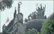  ?? HT FILE ?? Kar sevaks climb the dome of Babri Masjid while demolishin­g it in 1992.