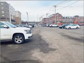  ?? Brian Gioiele / Hearst Connecticu­t Media ?? Developer John Guedes has proposed constructi­on of a four-story building, with first-floor commercial and three floors of apartments on what was the former Chromium Procession site on Canal Street. The land is presently used for parking.