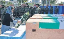  ?? HT PHOTO ?? Chief minister Mehbooba Mufti pays tribute to soldiers, who were killed in a terrorist attack on Sunjuwan military station, at a wreathlayi­ng ceremony in Jammu on Tuesday.