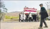  ?? GETTY FILE ?? Family members carry a coffin in Shaanxi Province.