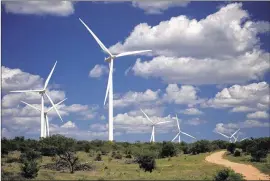  ?? CONTRIBUTE­D BY AUSTIN ENERGY 2010 ?? Wind turbines turn at a wind farm north of Abilene. Texas has more than 14,000 megawatts of installed wind capacity, which provides at least 9 percent of the electricit­y powering the state.