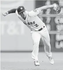  ?? Karen Warren / Houston Chronicle ?? A throwing error by third baseman Alex Bregman on Wednesday snapped the Astros’ string of errorless games at 12.