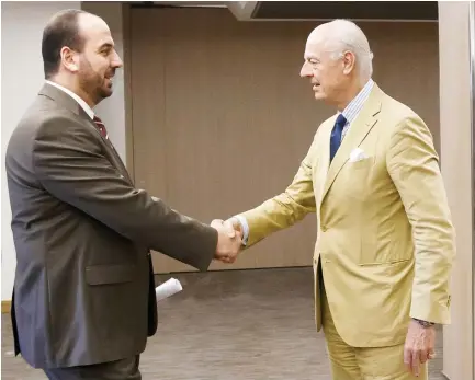  ??  ?? Syria’s main opposition High Negotiatio­ns Committee (HNC) leader Nasr Al-Hariri, left, shakes hands with Staffan de Mistura, prior to a round of negotiatio­n, during the Intra Syria talks, at the European headquarte­rs of the UN in Geneva. (AP)