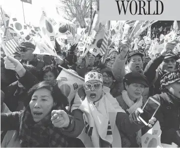  ?? AHN YOUNG-JOON / THE ASSOCIATED PRESS ?? Supporters of former South Korean president Park Geun-hye protest in Seoul on Friday after the country’s Constituti­onal Court formally removed the impeached leader from office over a corruption scandal.