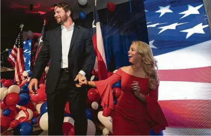  ?? Brett Coomer / Staff photograph­er ?? Republican Texas Rep. Dan Crenshaw and his wife, Tara, celebrate with supporters Tuesday night in Houston.