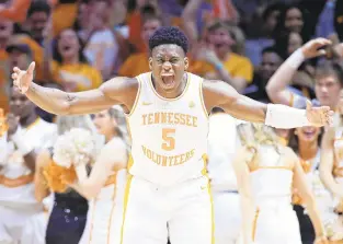  ?? ANDY LYONS/TNS ?? Tennessee’s Admiral Schofield celebrates during Saturday’s victory against Kentucky. The Volunteers defeated the Wildcats 71-52 and share first place in the Southeaste­rn Conference with LSU.