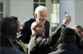  ?? Patrick Semansky/Associated Press ?? President Joe Biden poses for photos after signing the Emmett Till Anti-Lynching Act on Tuesday in the Rose Garden of the White House in Washington.