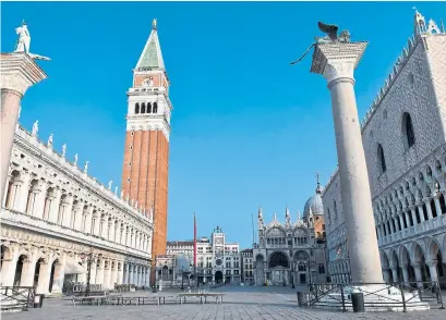  ?? MARCO SABADIN AFP/GETTY IMAGES FILE PHOTO ?? Piazza San Marco in Venice stands empty, after Italy imposed unpreceden­ted national restrictio­ns to combat COVID-19.