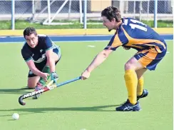  ?? PHOTO: LINDA ROBERTSON ?? On his knees . . . Kings United player Hitaua ArahungaDo­yle (left) looks to move the ball past Taieri Tuataras player Matthew West at the McMillan Centre on Saturday.