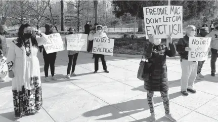  ?? HANNAH KANE/AP ?? Tenants protest at Freddie Mac headquarte­rs in McLean on March 15. Residents of the Southern Towers apartment complex fear they’re being squeezed out. They see warning signs all around as the complex of five, 16-story buildings sold last year for half a billion dollars.