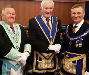  ??  ?? Keith Ramsden, centre, celebratin­g 50 years of freemasonr­y in 2016.