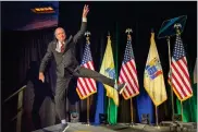  ?? AP PHOTO BY TOM GRALISH ?? New Jersey Gov.-elect Phil Murphy leaps as he jumps onto the stage at his victory party Tuesdayin Asbury Park, N.J.