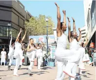  ?? PICTURE: COURTNEY AFRICA ?? HIDDEN PLACES, PUBLIC SPACES: This choreograp­hic activation at the Bart Simpson statue in St George’s Mall transforms the shopping precinct into a new dimension of theatre with chance encounters for the public.