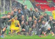  ?? AFP PHOTO ?? Manchester City players celebrate after beating Aston Villa 2-1 in the League Cup final on Sunday.