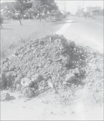  ??  ?? The pile of mud that the motorcycle reportedly collided with. It is one of many along the Cummings Lodge access road and which take over a significan­t portion of the roadway.