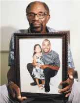  ?? Scott Strazzante / The chronicle ?? Mack Wilson with photo of granddaugh­ter Anjolie and her dad, Neko Wilson, Mack’s son charged with murdering a couple who died in a robbery Neko Wilson allegedly helped plan.