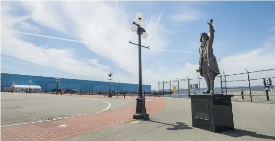  ?? DARREN STONE, TIMES COLONIST ?? The Town Cryer statue beckons at an eerily empty Ogden Point terminal on Friday. A record 300 cruise ships were scheduled to call this season, bringing 770,000 passengers.