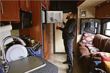  ?? Santiago Mejia / The Chronicle ?? Jose Diaz, who lost his apartment after losing work because of the pandemic, lives in his RV near Lake Merced in San Francisco. Many other Latinos in RVs on the street are also trying to get back on their feet.