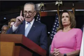  ?? EVAN VUCCI — THE ASSOCIATED PRESS ?? Senate Minority Leader Charles Schumer of N.Y., accompanie­d by House Minority Leader Nancy Pelosi of Calif., speaks during a news conference about President Barack Obama’s signature healthcare law, Wednesday on Capitol Hill in Washington.